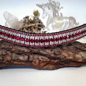 Elegant Ruby Radiance Browband displayed on a decorative wood base