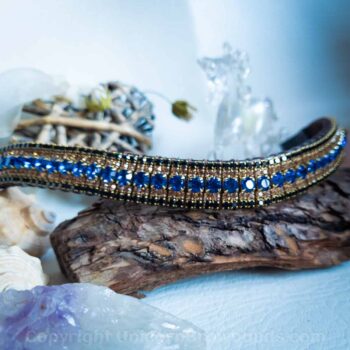 Elegant horse browband featuring Capri blue crystals with black and gold highlights set in brass, exuding luxury and brilliance