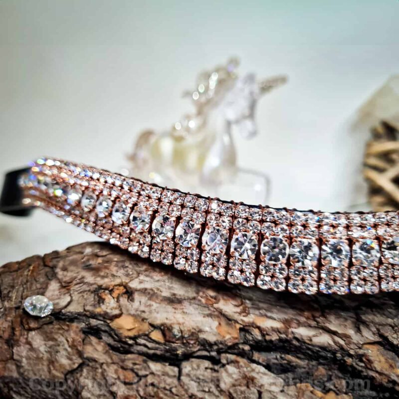 Elegant rose gold wave-shaped crystal browband, perfect for adding a touch of luxury to dressage attire.