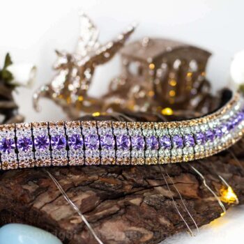 Purple browband with gold edging with a unicorn ornament in the background