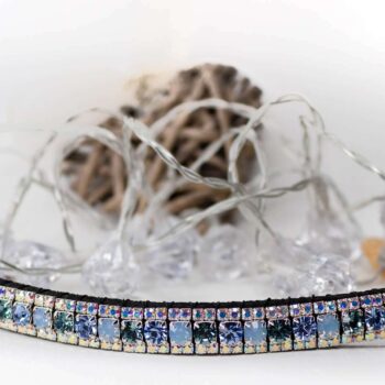 Alternating blue browband from unicorn browbands on a white back drop with crystal LED lights